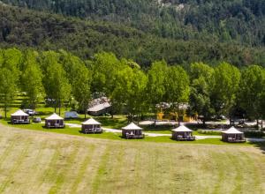 an aerial view of a group of tents in a field at Camping du Villard in Thorame-Basse