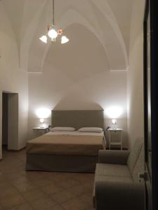 Säng eller sängar i ett rum på Corte del Fico