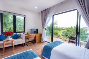 Svetainės erdvė apgyvendinimo įstaigoje Hoi An Reverie Villas