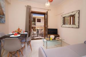 a living room with a table and a dining room at Apollon Apartment In Argostoli in Argostoli