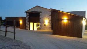 a building with lights on the side of it at La Ry'Bambelle in Les Herbiers