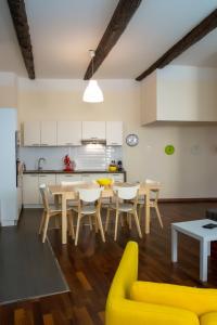a kitchen and dining room with a table and chairs at Magnifiques Appartements au coeur du Vieux Nice in Nice +10 photos