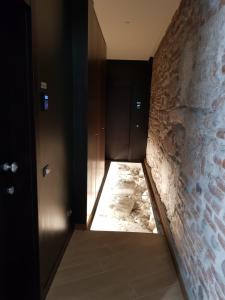 Postel nebo postele na pokoji v ubytování Arena Luxury Suite