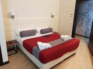 Postel nebo postele na pokoji v ubytování Arena Luxury Suite