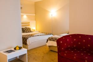 Postel nebo postele na pokoji v ubytování Arsen Hotel