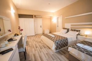 Postel nebo postele na pokoji v ubytování Arsen Hotel