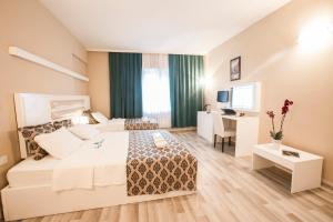 Postel nebo postele na pokoji v ubytování Arsen Hotel