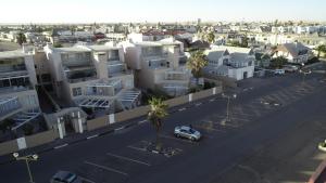 an aerial view of a city with white buildings at Sand & Sea Holiday Home in Swakopmund