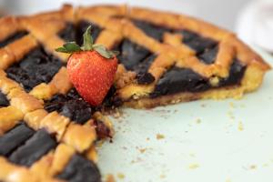 a strawberry on top of a chocolate waffle at Yes Hotel Touring & SPA in Rimini