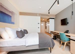 Televízia a/alebo spoločenská miestnosť v ubytovaní Hotel Park Plava Laguna