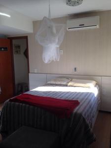 Кровать или кровати в номере Cobertura Praia do Morro