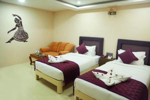 Postel nebo postele na pokoji v ubytování Athena Hotel