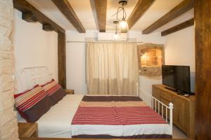 Łóżko lub łóżka w pokoju w obiekcie Dalmatian House