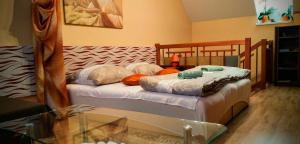 A bed or beds in a room at Apartmán Slnečnica
