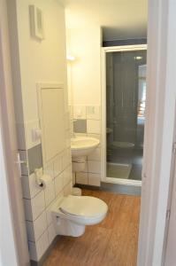 a bathroom with a toilet and a sink at Village club de Bois d'Amont in Bois-dʼAmont