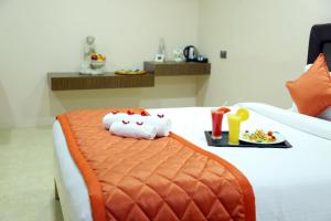 Postel nebo postele na pokoji v ubytování Athena Hotel