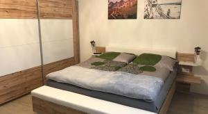 Ένα ή περισσότερα κρεβάτια σε δωμάτιο στο Appartement Luca