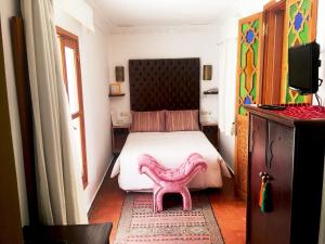 Uma cama ou camas num quarto em Hotel Blanco Riad