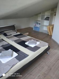 Posteľ alebo postele v izbe v ubytovaní Apartments Nogic