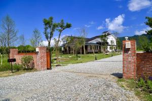 a brick driveway in front of a house at Sapientia in Guangfu