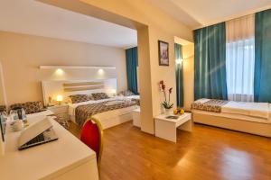Postel nebo postele na pokoji v ubytování Arsen Hotel