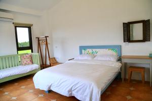 Una cama o camas en una habitación de Sapientia