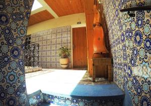 a room with blue and white tiles on the wall at Riad Les Chtis D'Agadir in Agadir