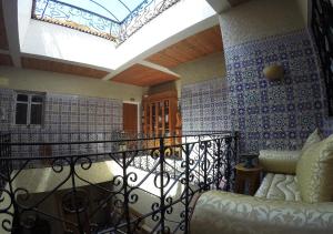 a room with a balcony with a skylight at Riad Les Chtis D'Agadir in Agadir