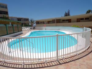 a large swimming pool with a fence around it at La Colina in San Agustin