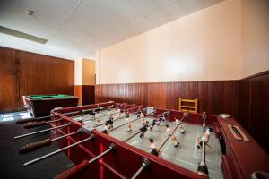 a group of girls playing a game of pool in a gym at Hotel Hipic in Vielha