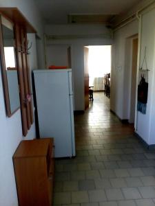 a kitchen with a white refrigerator in a room at Villa Marija Ulcinj in Ulcinj