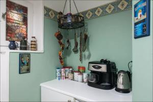 a kitchen with a counter with a coffee maker on it at Nephiria, Back to Tradition, In the heart of Plaka! in Athens