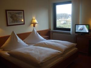 A bed or beds in a room at Hotel Rose