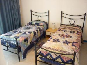 Ένα ή περισσότερα κρεβάτια σε δωμάτιο στο Baia Arcile Case Vacanza