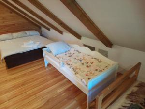 Postel nebo postele na pokoji v ubytování Apartman rico
