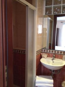 a bathroom with a sink and a mirror at Hotel Locanda Salieri in Venice