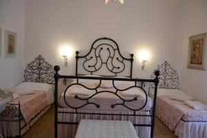 Ліжко або ліжка в номері B&B Villa Il Poggiolino