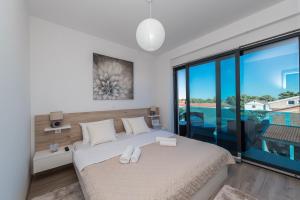 Posteľ alebo postele v izbe v ubytovaní Luxury Apartments VilaMaloca