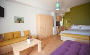 Postel nebo postele na pokoji v ubytování Elina Apartments