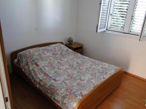 Postel nebo postele na pokoji v ubytování Apartmani Tepli Bok