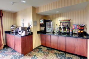 a bar in a hotel room with a counter at Cobblestone Hotel - Wayne in Wayne