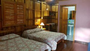 Voodi või voodid majutusasutuse Ciudad Perdida EcoLodge toas
