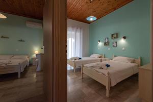 Postel nebo postele na pokoji v ubytování Villa Tasos Koutsoubos