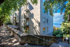 a building with stairs in front of it at Jasmina apartment in Rijeka