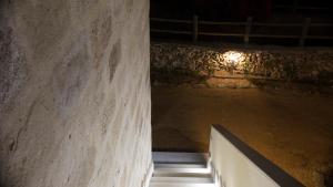 a hallway in a building with a concrete wall at Le Suites del Carrubo in Favignana