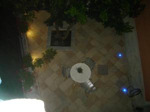 an overhead view of a table and two chairs on a sidewalk at La Dolce Vita B&B in Noli