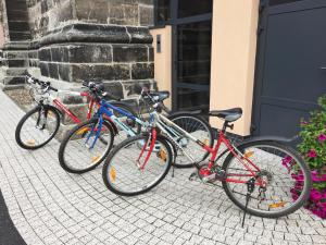three bikes parked next to a building at Czarna Wieża in Lwówek Śląski