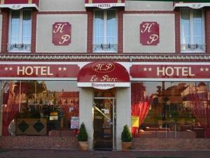 a store front with a sign on the front of it at Hotel Du Parc in Cabourg