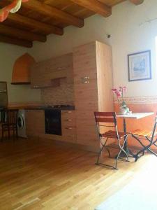 a kitchen with a table and chairs in a room at Cagliari Dream in Cagliari