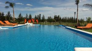 a large swimming pool with a slide and a playground at Dreams Rest in Gualeguaychú